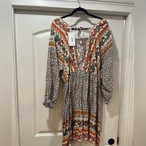 Gorgeous dress , stunning colors .. low front and back .. new with tags